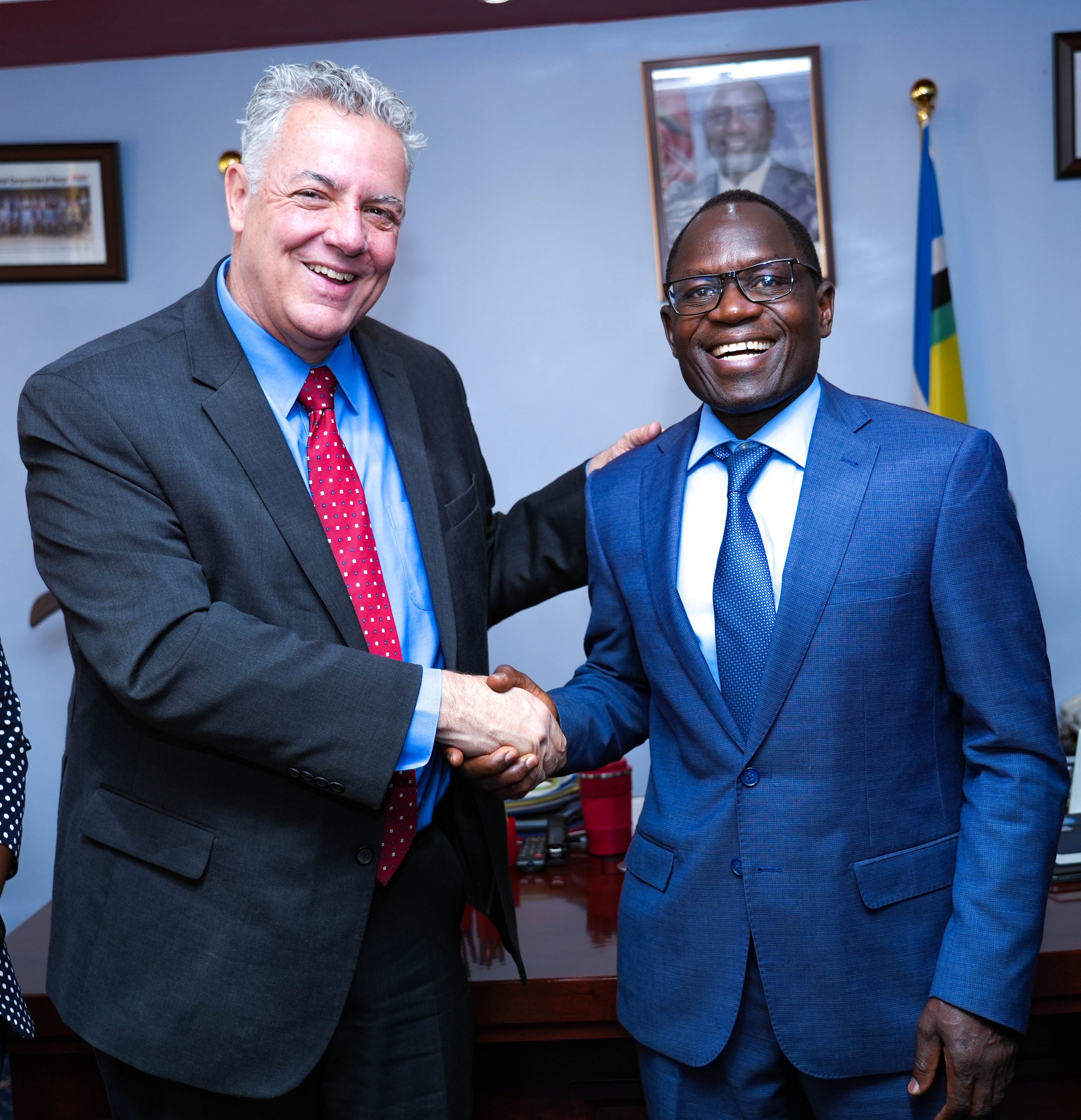 PS Stephen Isaboke, EBS (right) and Mr. John Giusti, Chief Regulatory Officer and President of the GSMA Mobile for Development Foundation