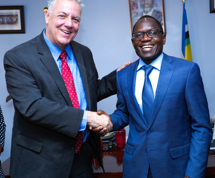 PS Stephen Isaboke, EBS (right) and Mr. John Giusti, Chief Regulatory Officer and President of the GSMA Mobile for Development Foundation